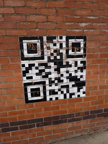 QR Code vs SMS - Brickwall class=