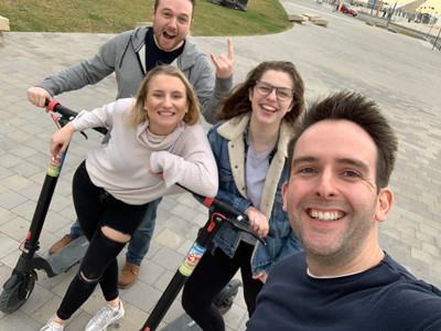 FireText team riding scooters